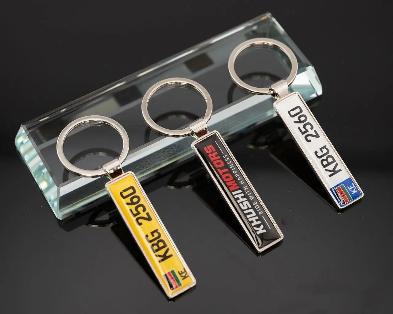 Three number-plate style keyholders, Hensa