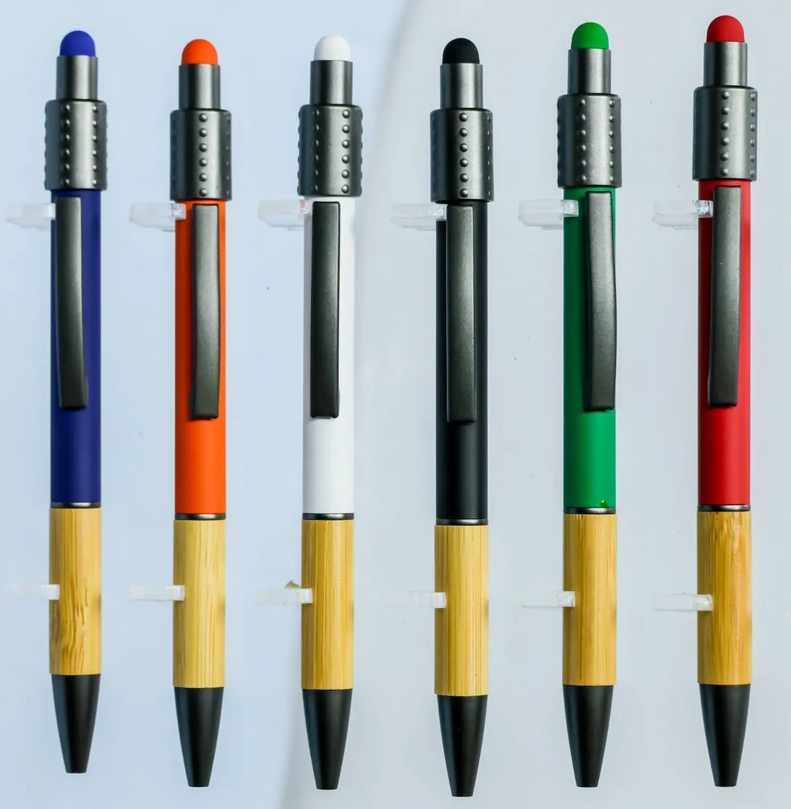 Six click pens in blue, orange, white, black, green and red with wooden grips and stylus tips, Hensa