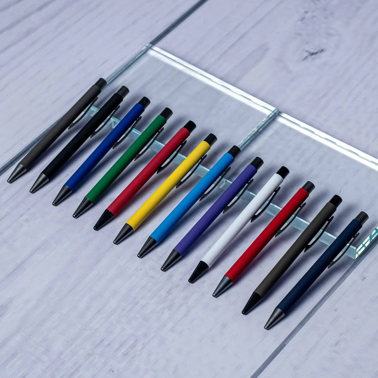 Plastic pens in several colours on a light background, Hensa