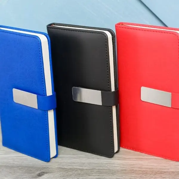 Blue, black and red A6 notebooks 001 with strap and metal plate closures, Hensa