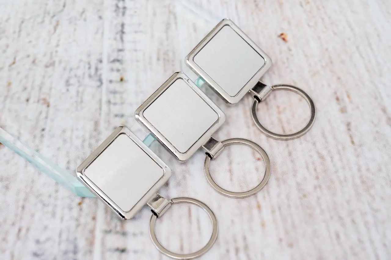 Three square metal keyholders, Hensa