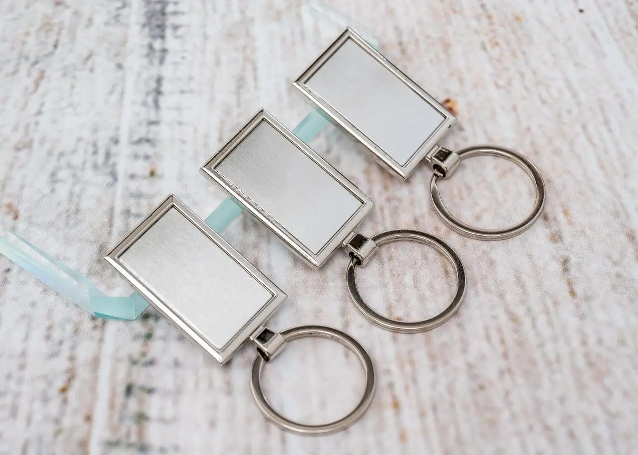 Three rectangular metal frame keyholders, Hensa