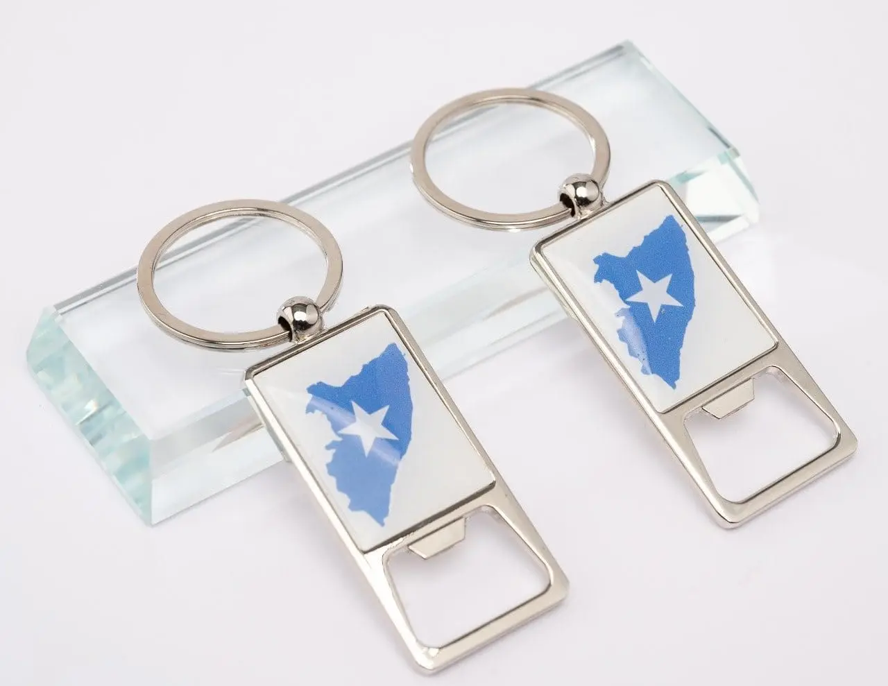 Two printed bottle opener keyholders, Hensa