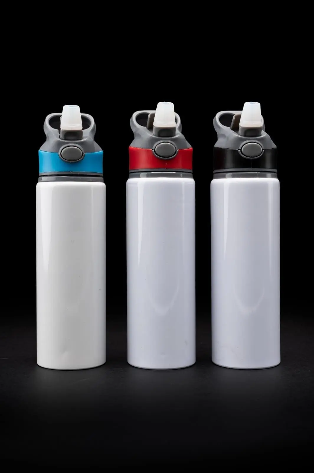 Three white 750ml water bottles with grey spout lids and coloured collars, Hensa