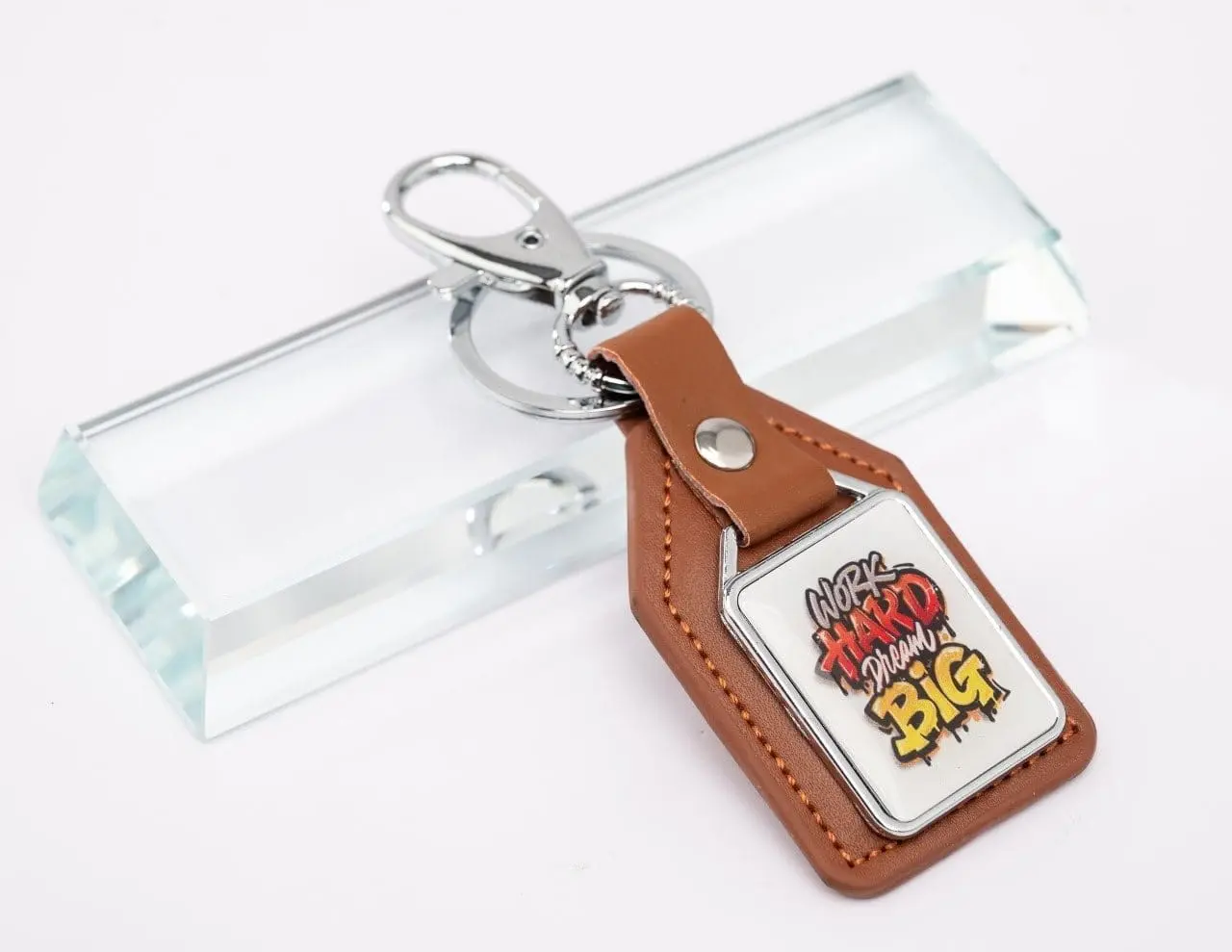Tan leather keyholder with a printed insert, Hensa