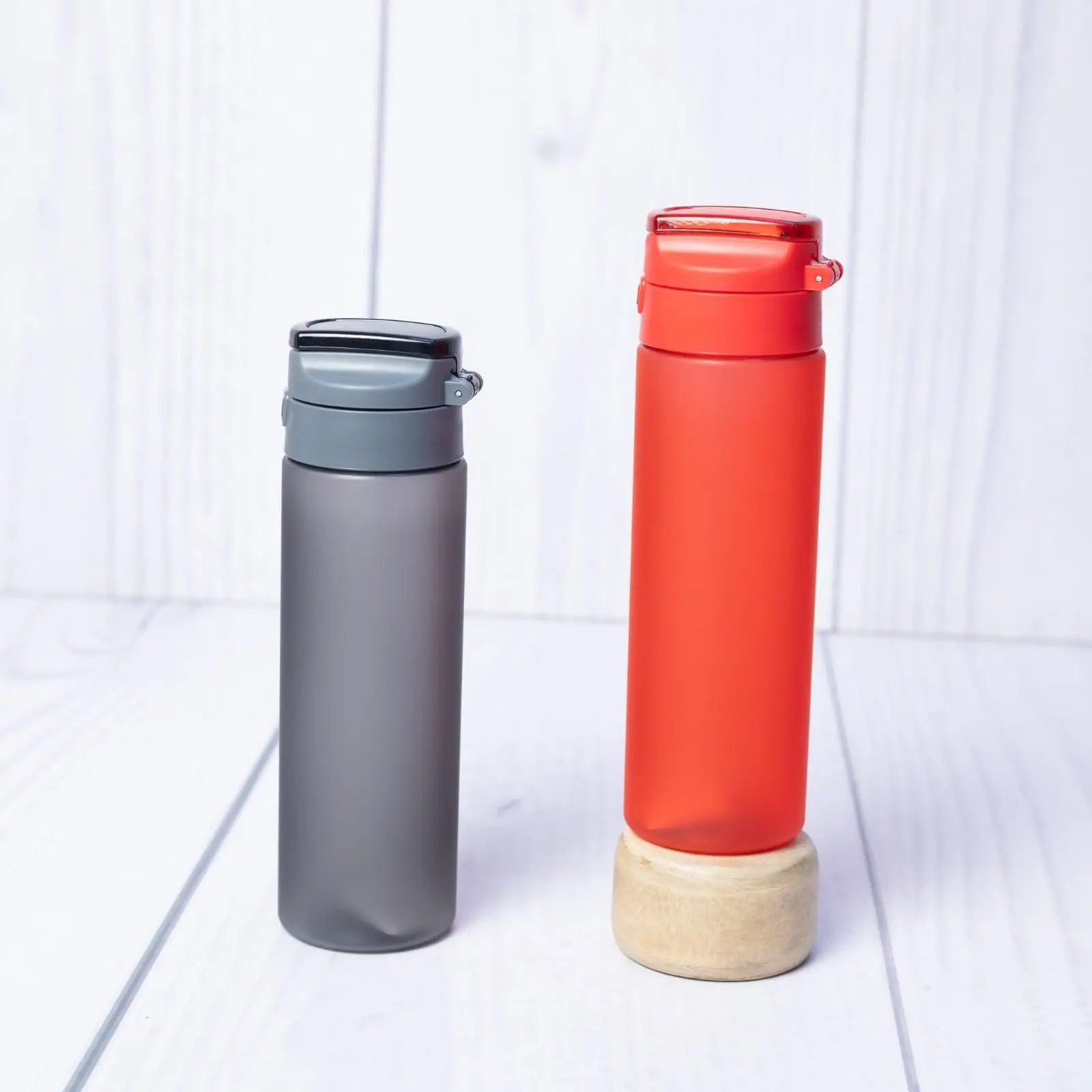 Grey and red frosted plastic water bottles with flip-up lids, Hensa