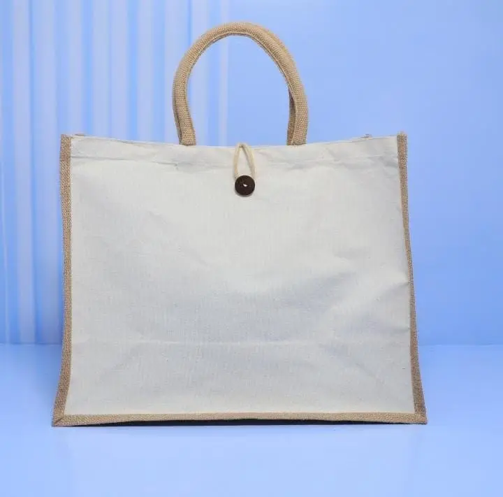 Landscape cream canvas bag with a natural jute trim, jute handles and a wooden button, Hensa
