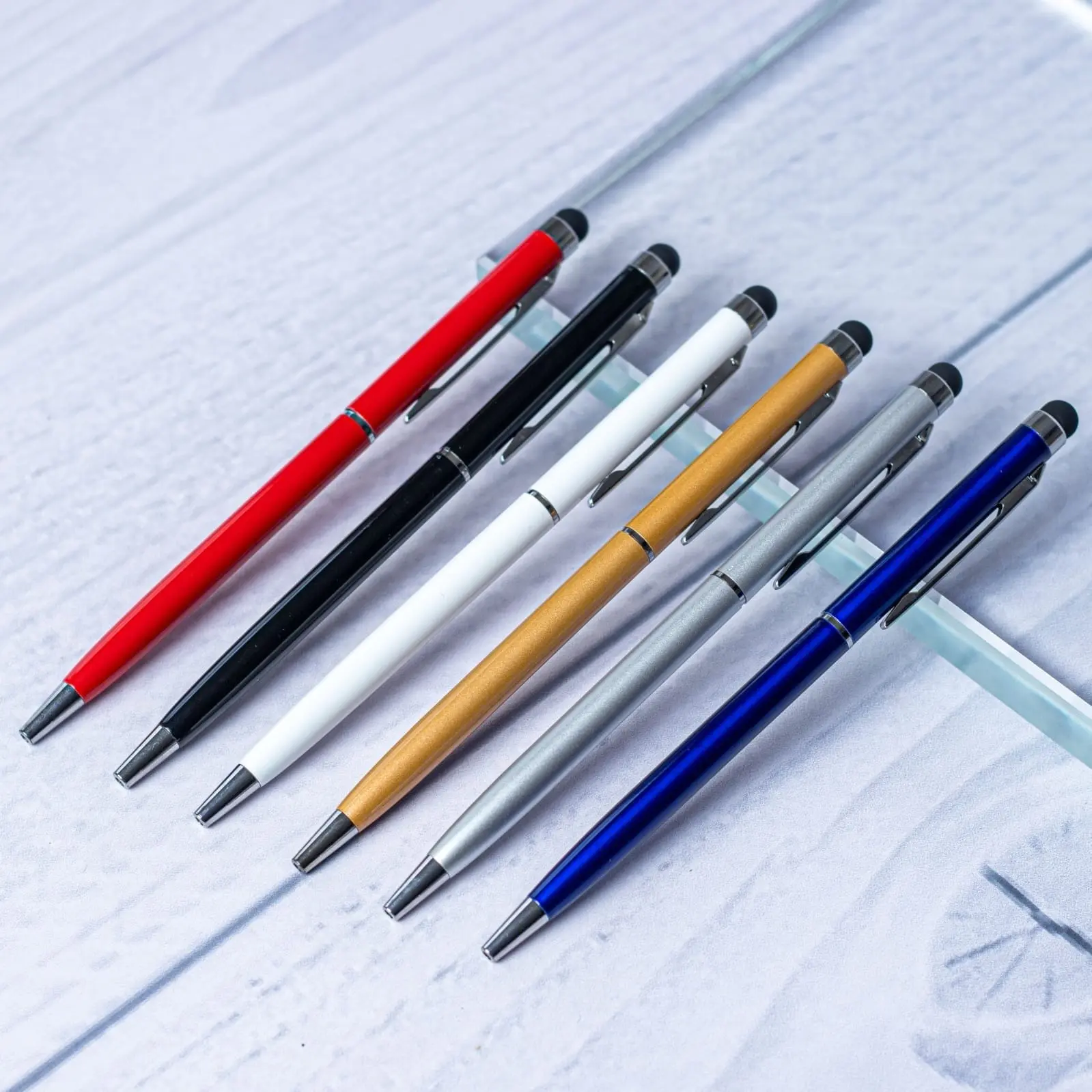 Six slim metal stylus pens in red, black, white, gold, silver and blue, Hensa
