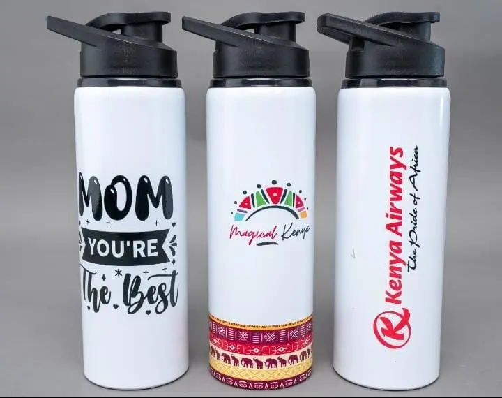 Three white 750ml water bottles with black flip lids and printed designs, Hensa