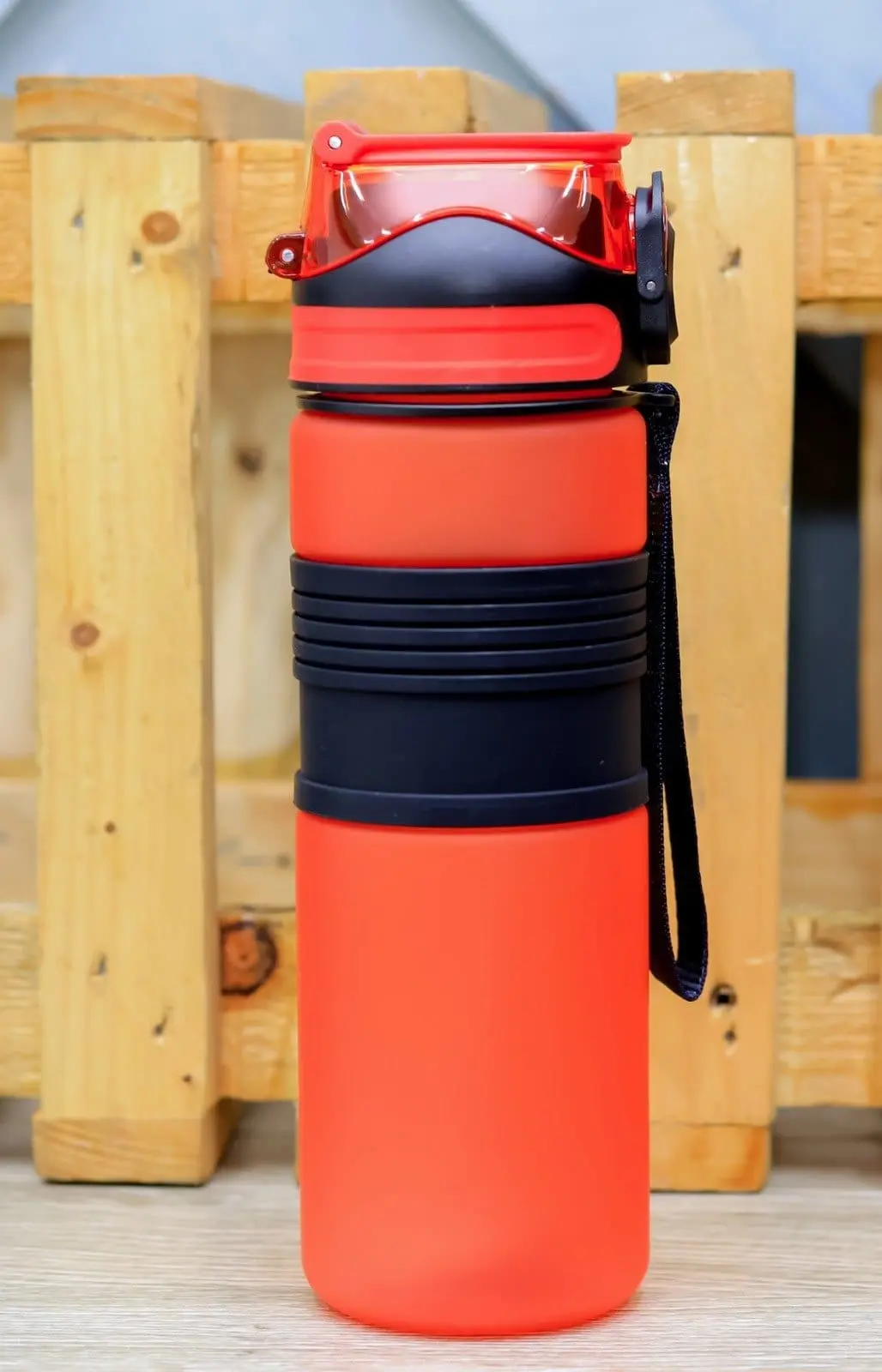 Red frosted 750ml plastic water bottle with black grip band and strap, Hensa