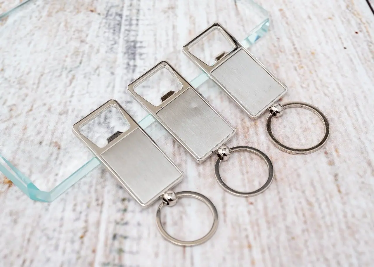 Three square metal bottle opener keyholders, Hensa