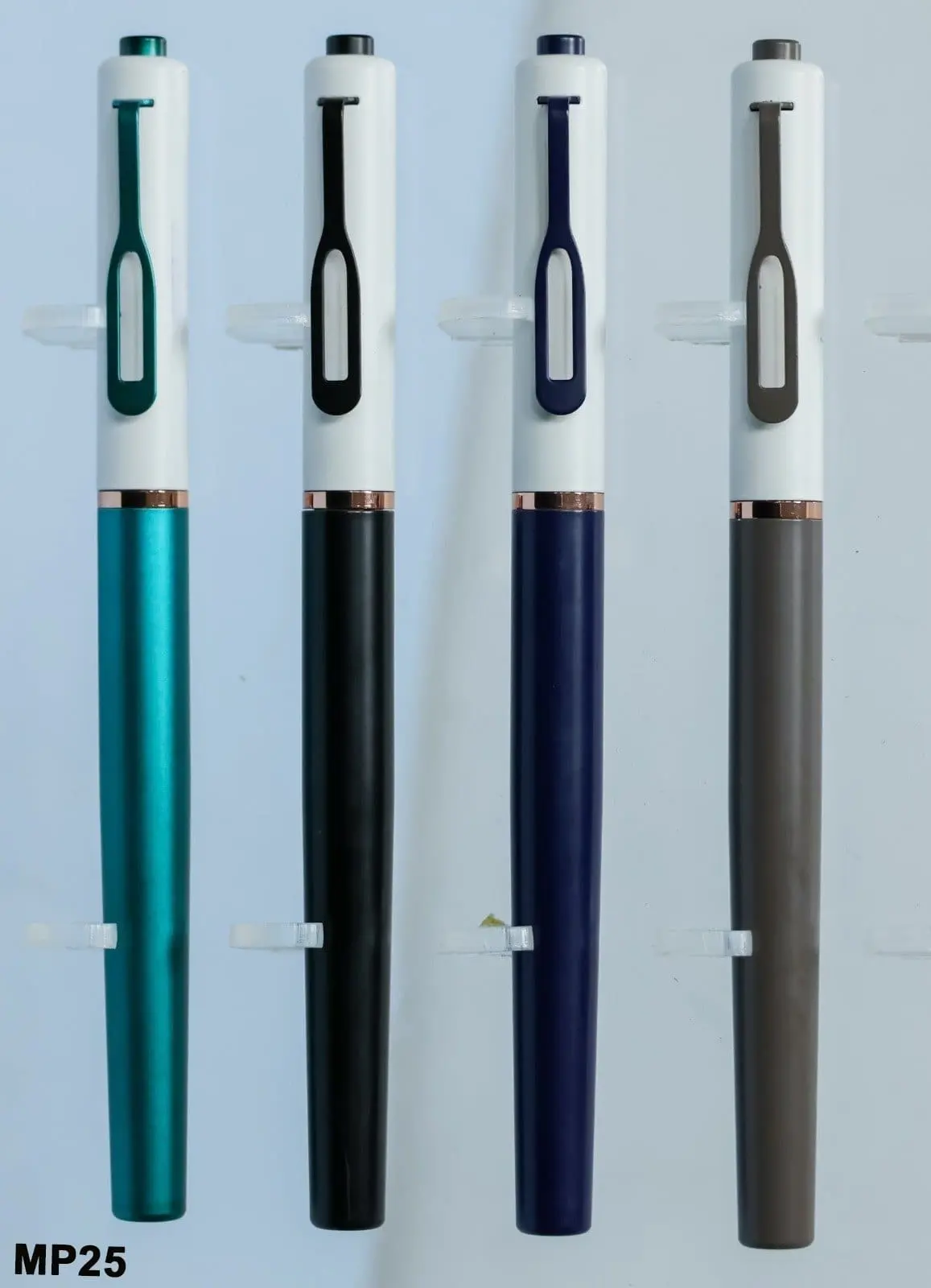 Four metal pens with white tops, loop clips and teal, black, navy and grey bodies, Hensa
