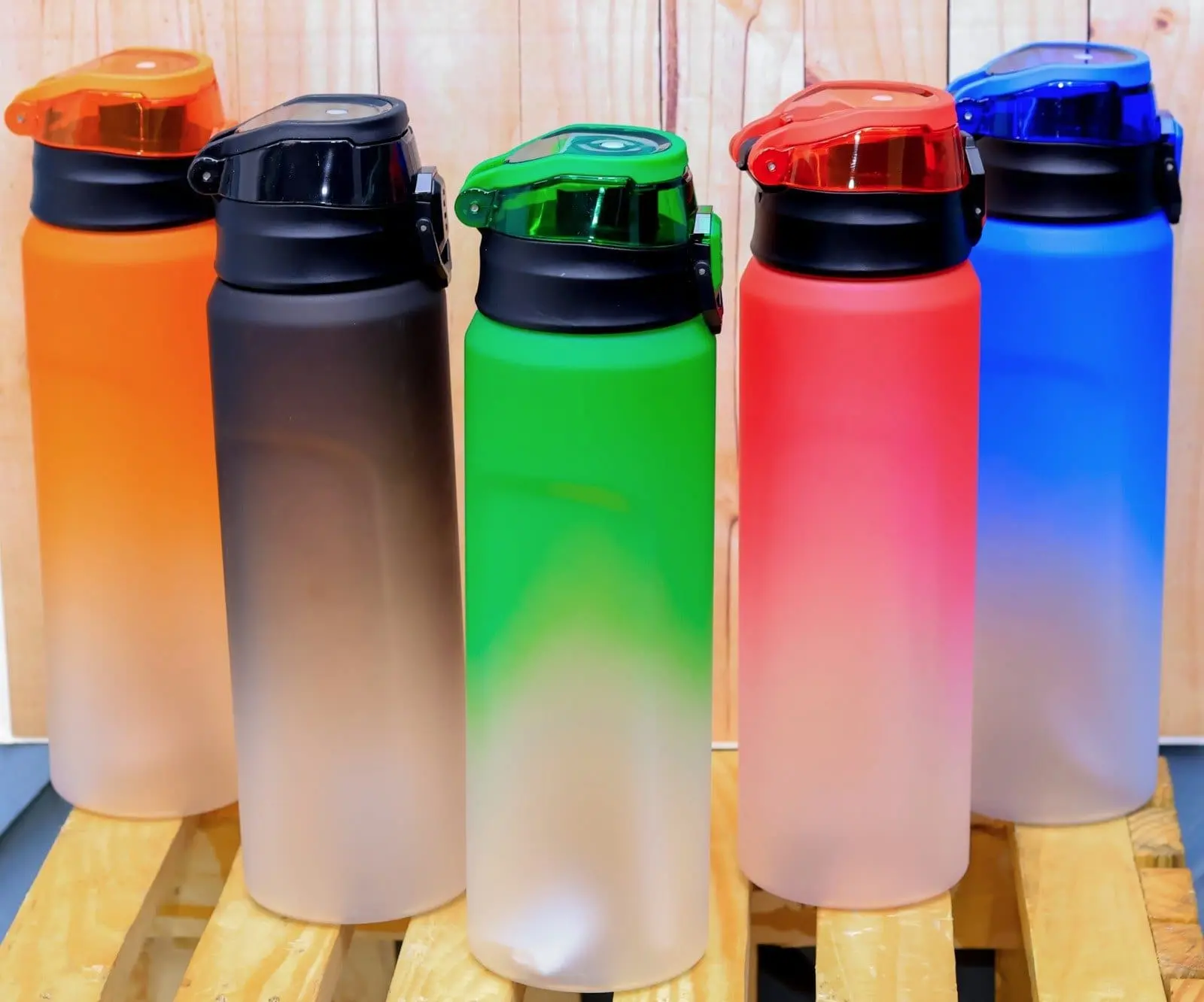 Five frosted 1000ml plastic water bottles with colour fades and flip lids, Hensa