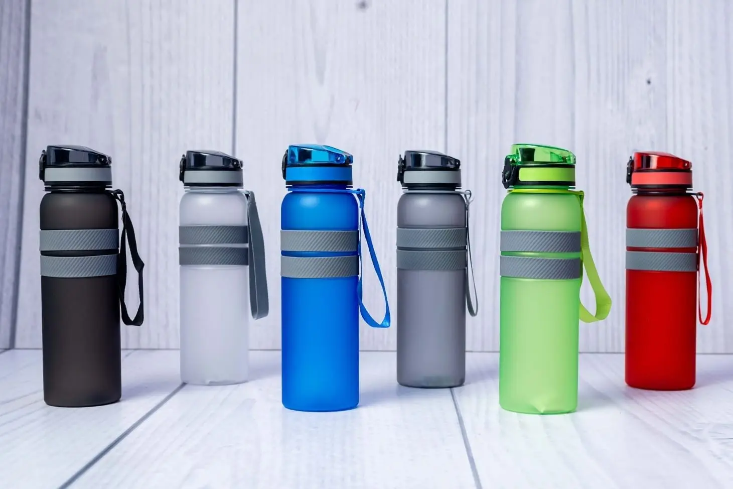 Six frosted plastic water bottles with carry straps and grip bands, Hensa