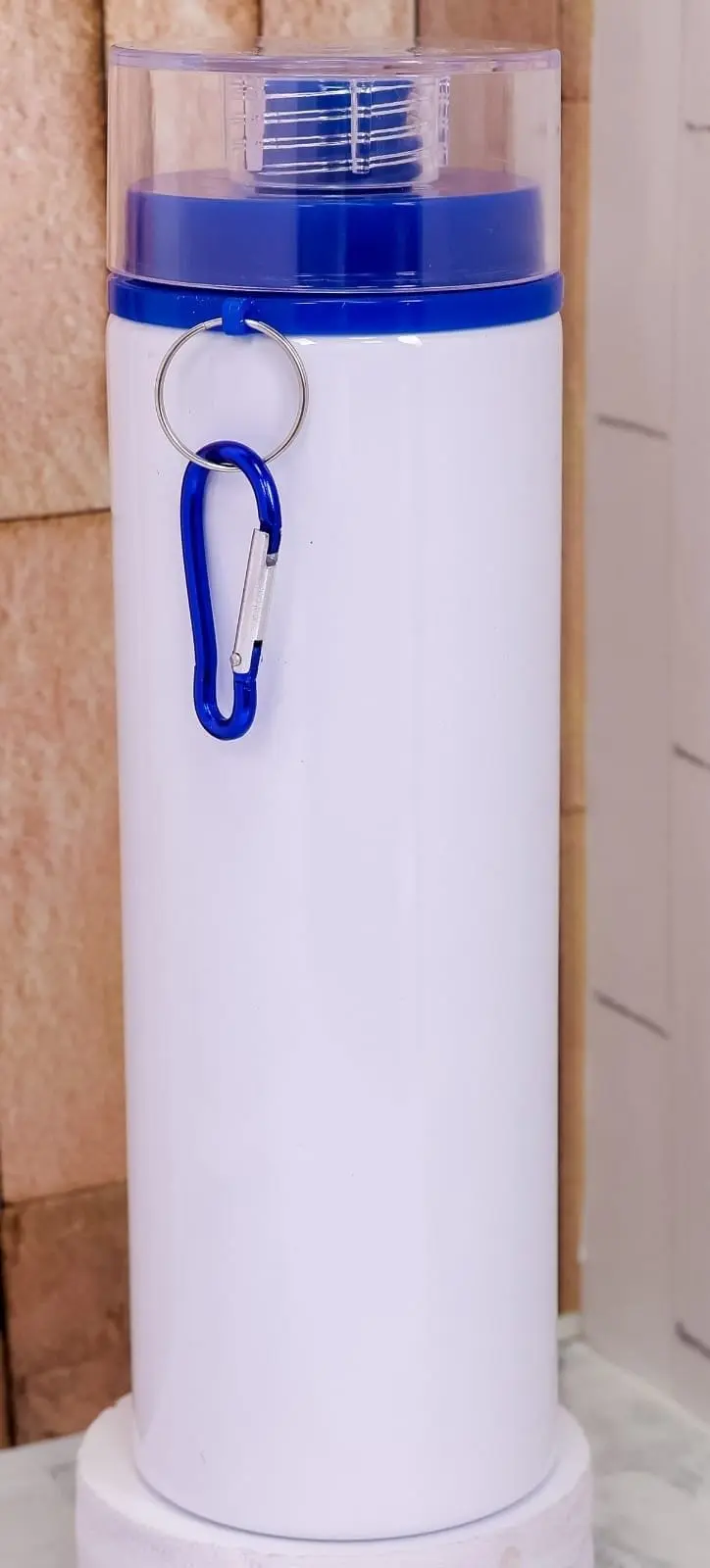 White sublimation water bottle with a clear cap, blue ring and carabiner, Hensa